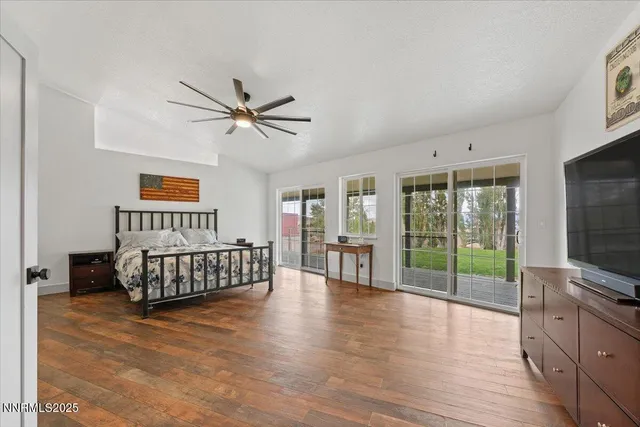 a view of a yard covered with snow in front of house