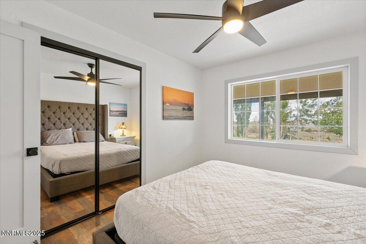 15030 North Red Rock Road Reno, NV 89508 - Photo 31 of 89 a bedroom with a bed and a window