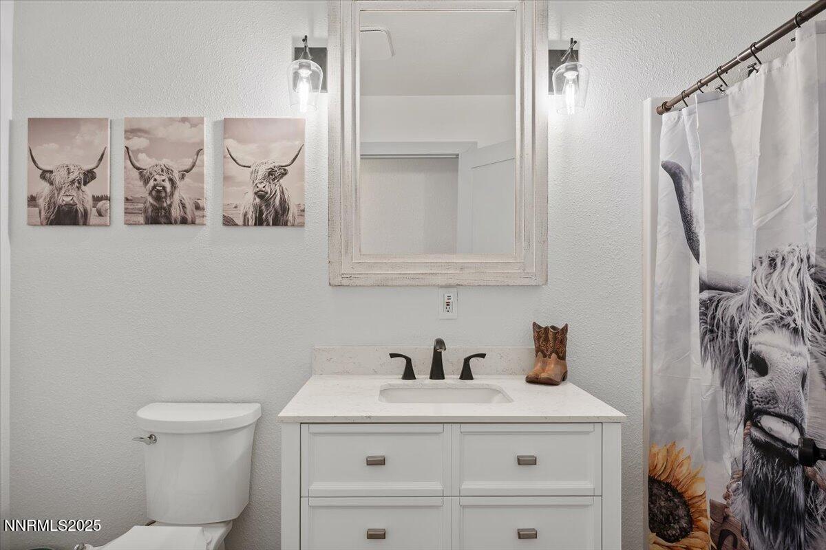 15030 North Red Rock Road Reno, NV 89508 - Photo 37 of 89 a bathroom with a sink and a mirror