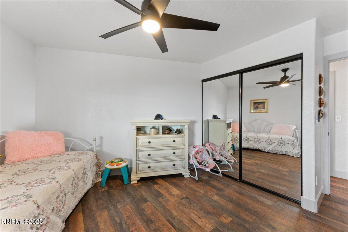 15030 North Red Rock Road Reno, NV 89508 - Photo 39 of 89 a bedroom with a bed and a walk in closet