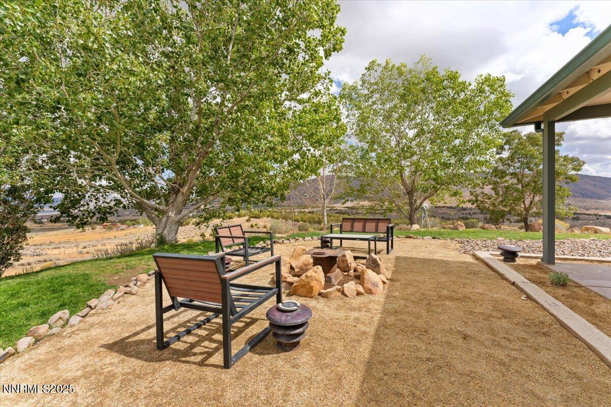 15030 North Red Rock Road Reno, NV 89508 - Photo 47 of 89 a view of a backyard with sitting area
