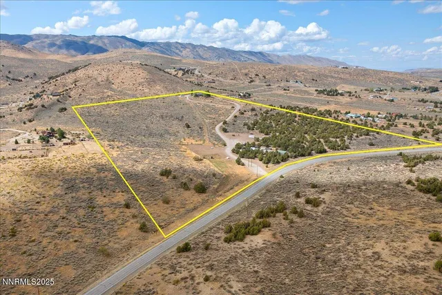 a kitchen with stainless steel appliances granite countertop a sink a stove a refrigerator and a refrigerator