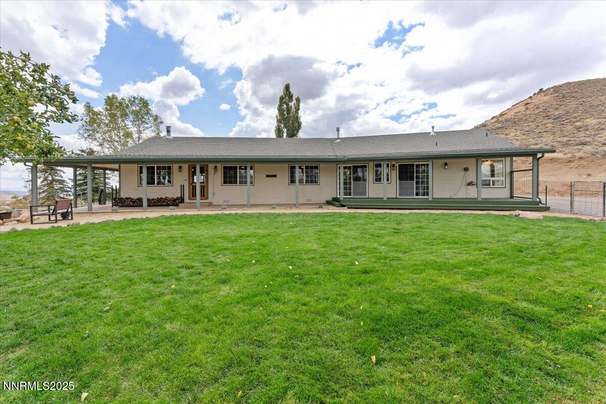 15030 North Red Rock Road Reno, NV 89508 - Photo 10 of 89 a view of a house with a big yard and potted plants