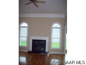 365 George Home Road Waynesboro, VA 22980 - Photo 3 of 4 a living room with a fireplace and a window