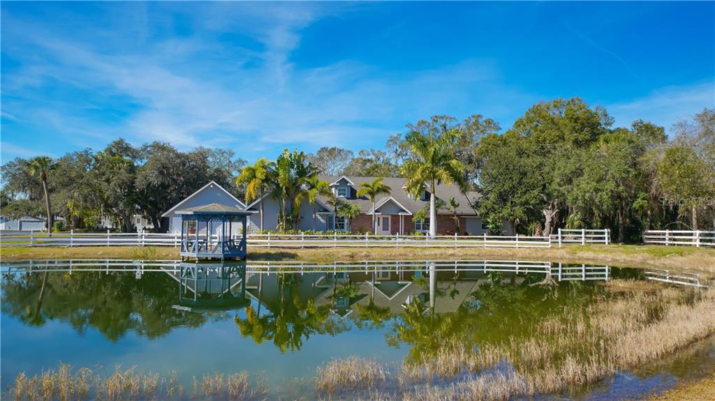 7112 Prospect Road Sarasota, FL 34243 - Photo 1 of 1 a view of a house with a yard