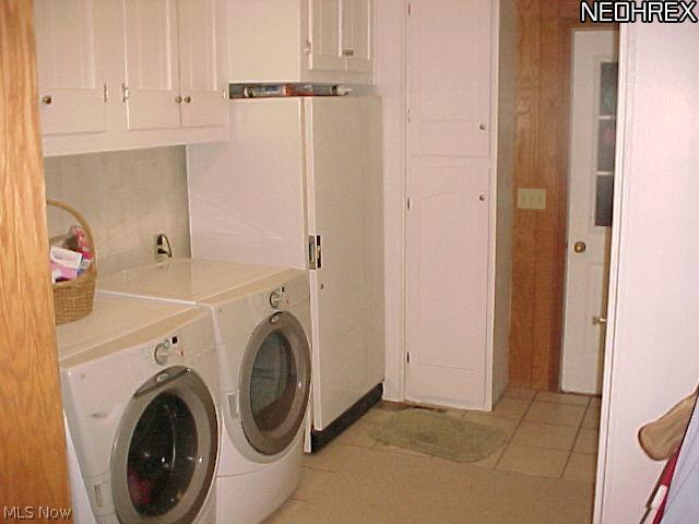 42157 Whitney Road Lagrange, OH 44050 - Photo 3 of 24 First floor laundry with loads of cabinets. Gas Dryer.