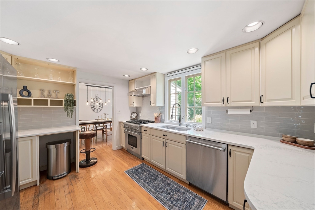 6 Garfield Street Lexington, MA 02421 - Photo 13 of 40 a kitchen with stainless steel appliances granite countertop a stove a sink dishwasher and a refrigerator