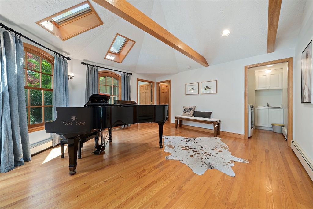 6 Garfield Street Lexington, MA 02421 - Photo 19 of 40 a living room with furniture and a table