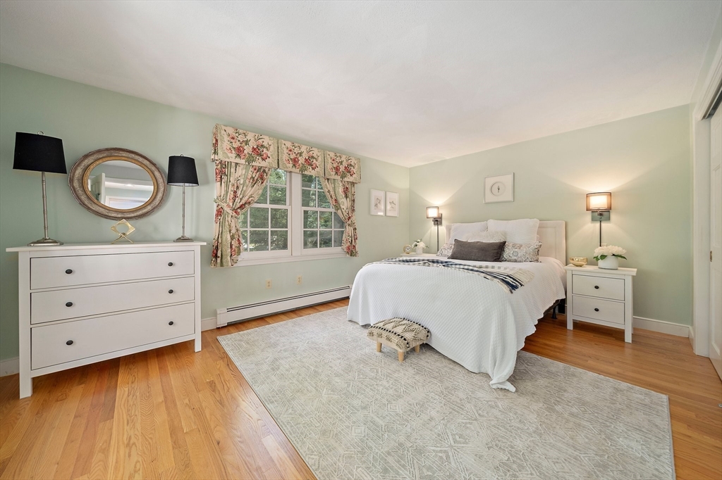 6 Garfield Street Lexington, MA 02421 - Photo 21 of 40 a bedroom with a bed and a window