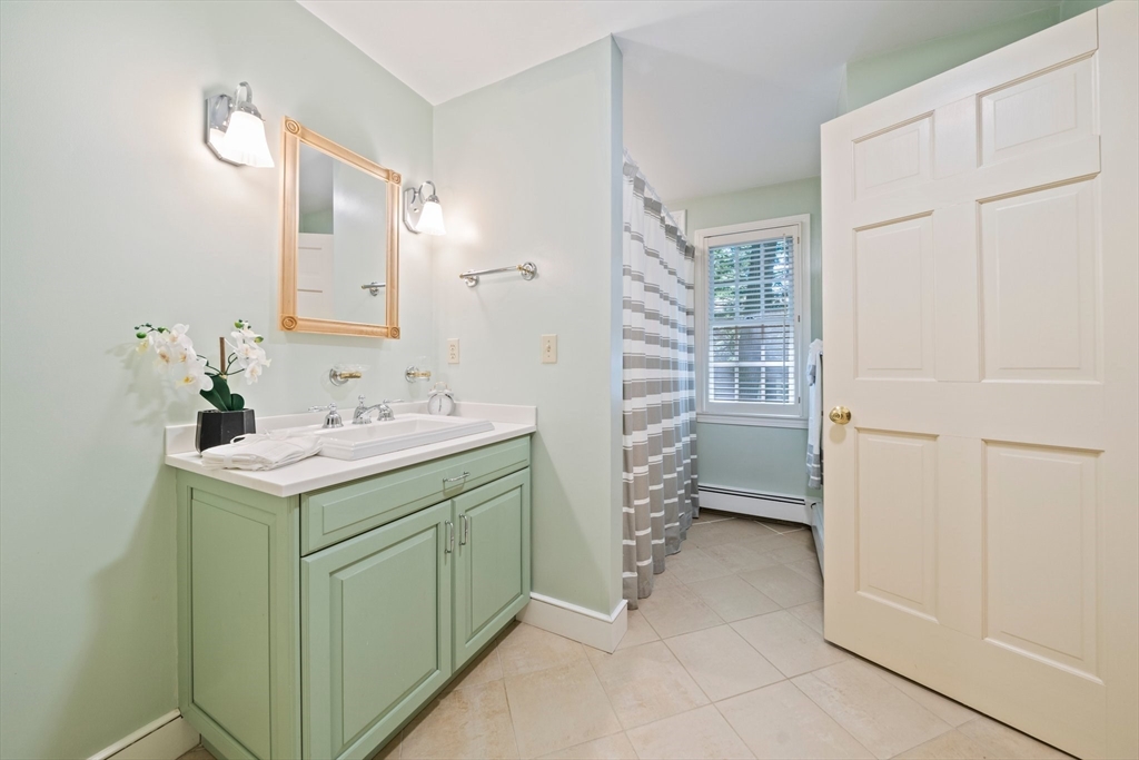 6 Garfield Street Lexington, MA 02421 - Photo 24 of 40 a utility room with cabinets washer and dryer