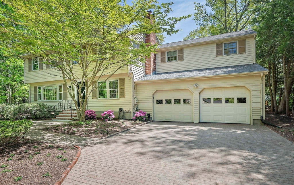6 Garfield Street Lexington, MA 02421 - Photo 3 of 40 a front view of a house with a yard
