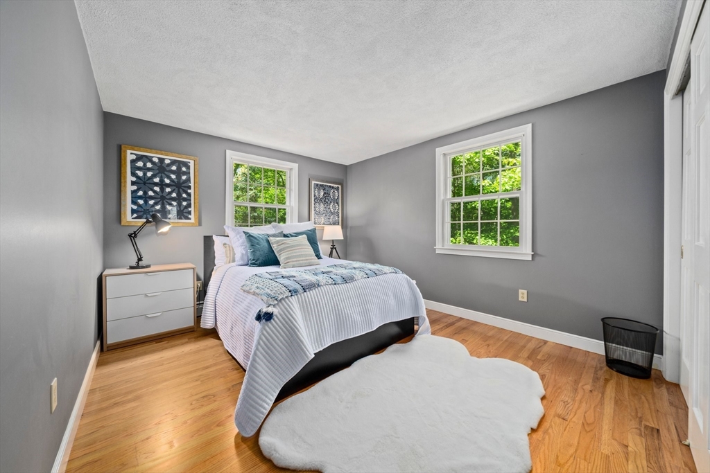 6 Garfield Street Lexington, MA 02421 - Photo 33 of 40 a bedroom with a bed and a couch