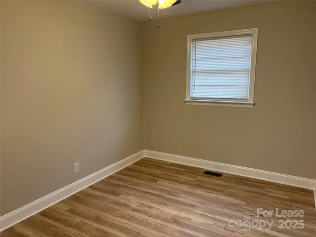 a view of a room that has a window in it