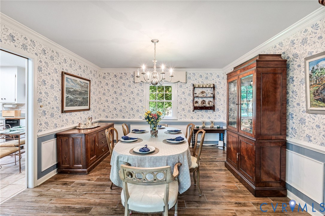 5700 Elfinwood Road Chester, VA 23831 - Photo 10 of 38 a view of a dining room with furniture window and wooden floor