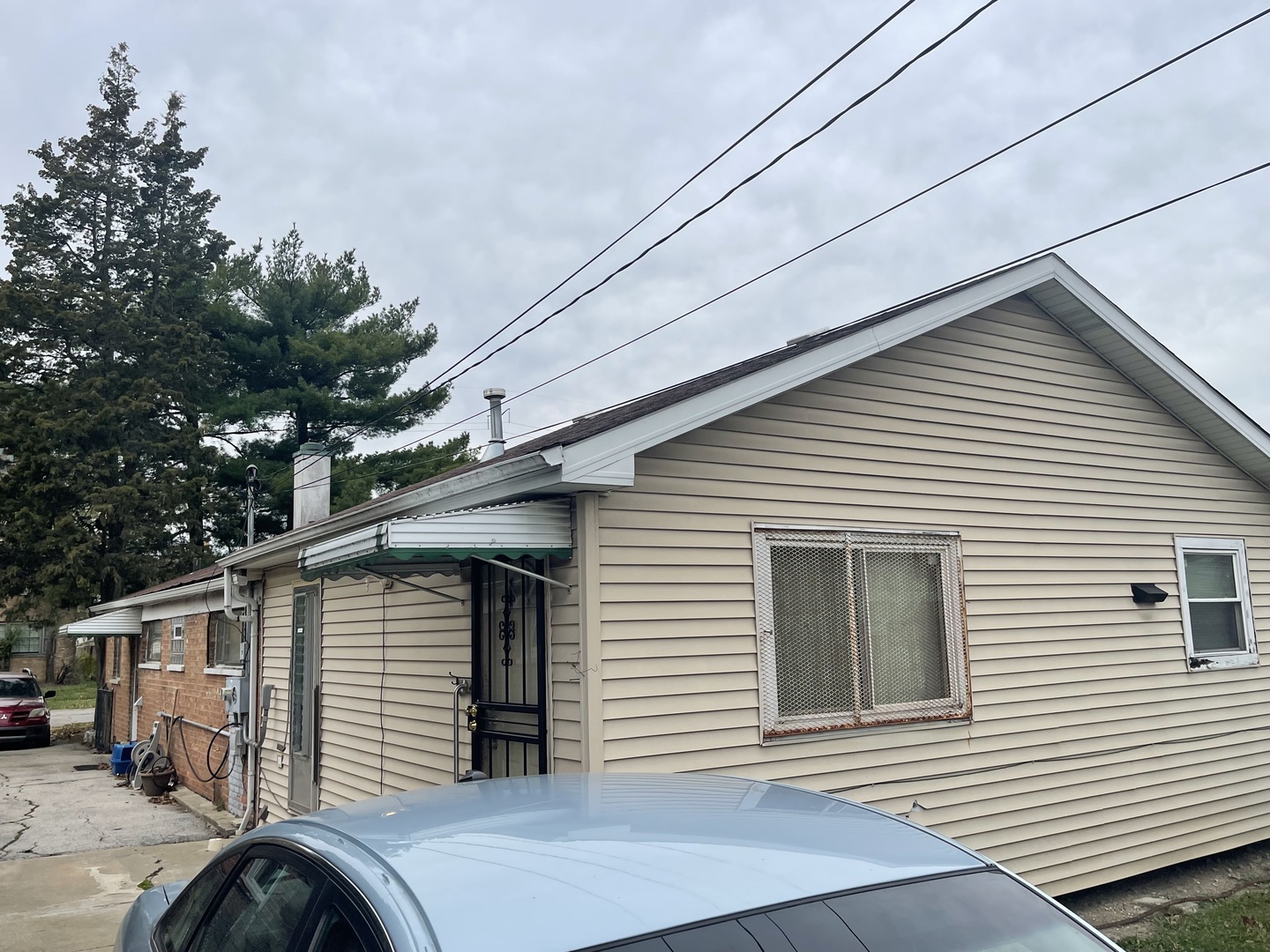 15311 Winchester Avenue Harvey, IL 60426 - Photo 5 of 6 a front view of a house with a garage