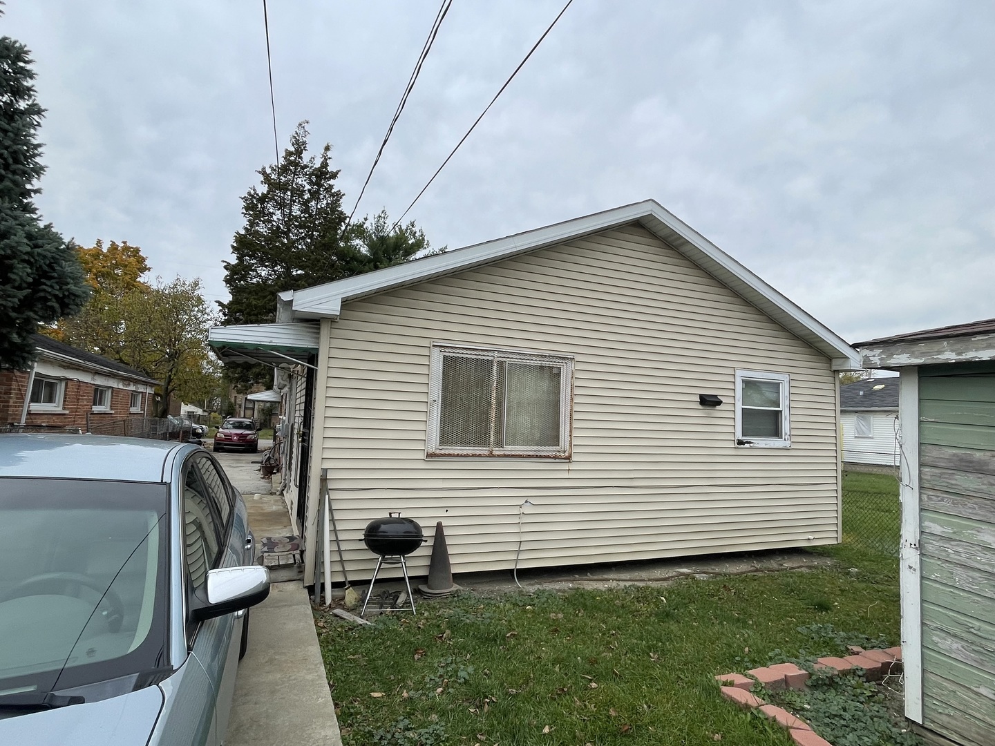 15311 Winchester Avenue Harvey, IL 60426 - Photo 6 of 6 a front view of a house with garden