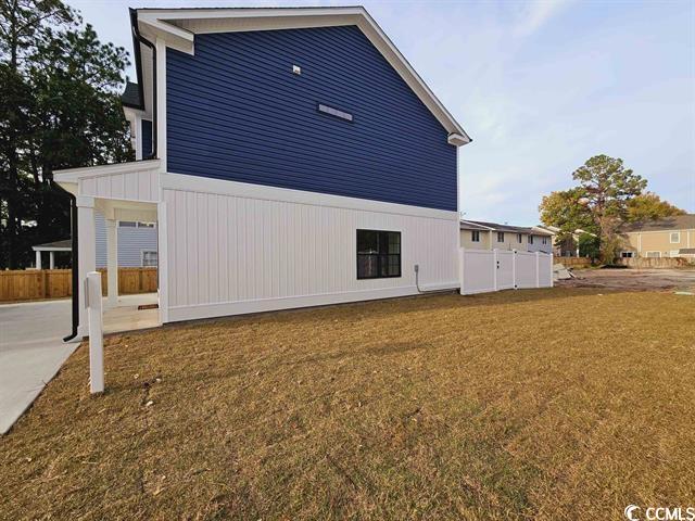 Tbd 67th Avenue North Myrtle Beach, SC 29572 - Photo 20 of 31 View of side of property featuring a yard