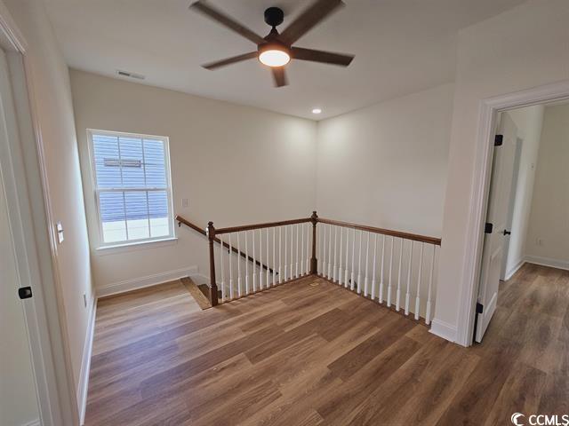 Tbd 67th Avenue North Myrtle Beach, SC 29572 - Photo 25 of 31 Empty room with a ceiling fan, visible vents, baseboards, and wood finished floors