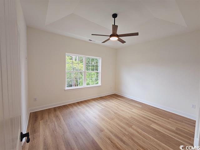 Tbd 67th Avenue North Myrtle Beach, SC 29572 - Photo 30 of 31 Unfurnished room with light wood-style floors, ceiling fan, and baseboards