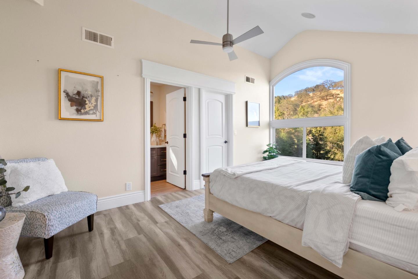 20394 Almaden Road San Jose, CA 95120 - Photo 50 of 92 a bedroom with a large bed and a chandelier