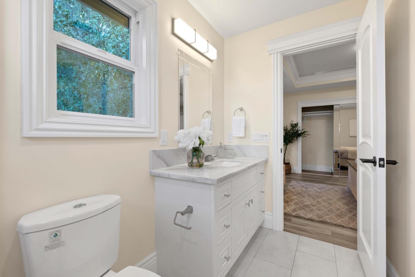20394 Almaden Road San Jose, CA 95120 - Photo 77 of 92 a bathroom with a sink a toilet and window