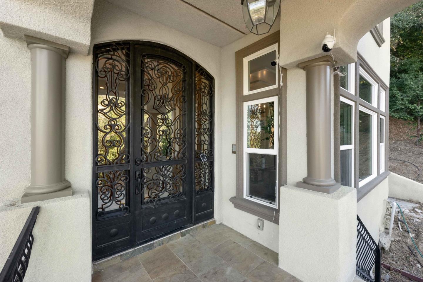 20394 Almaden Road San Jose, CA 95120 - Photo 89 of 92 a front view of a house with a glass door