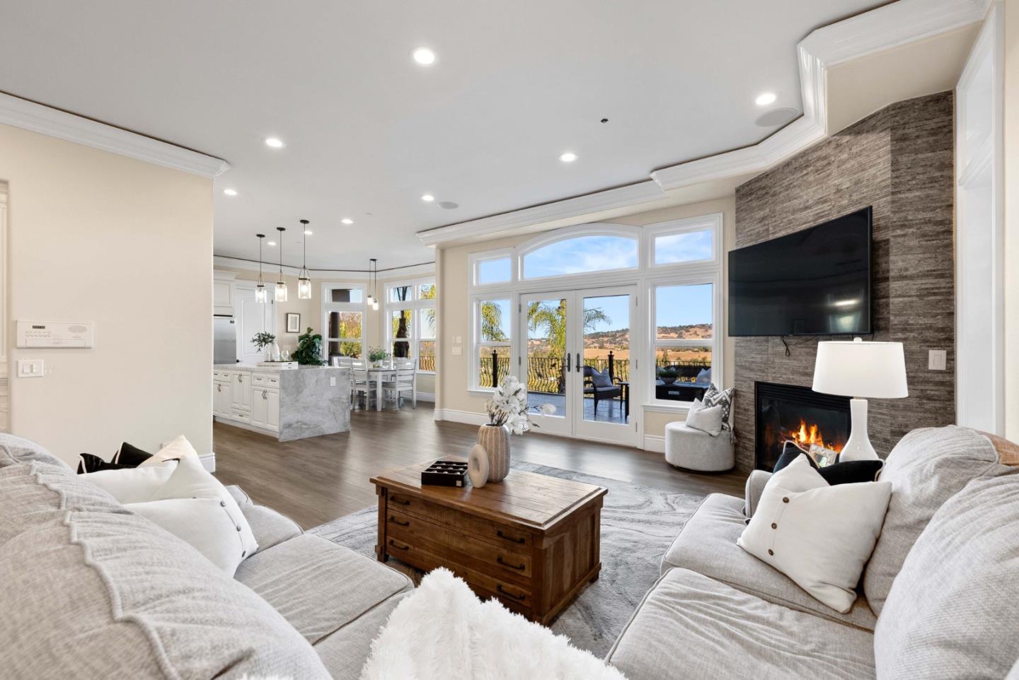 20394 Almaden Road San Jose, CA 95120 - Photo 10 of 92 a living room with furniture a flat screen tv and a fireplace