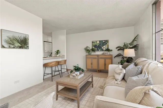 a living room with furniture and a painting on the wall