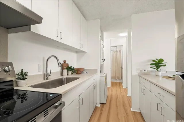 a spacious bathroom with a granite countertop sink a large mirror and shower