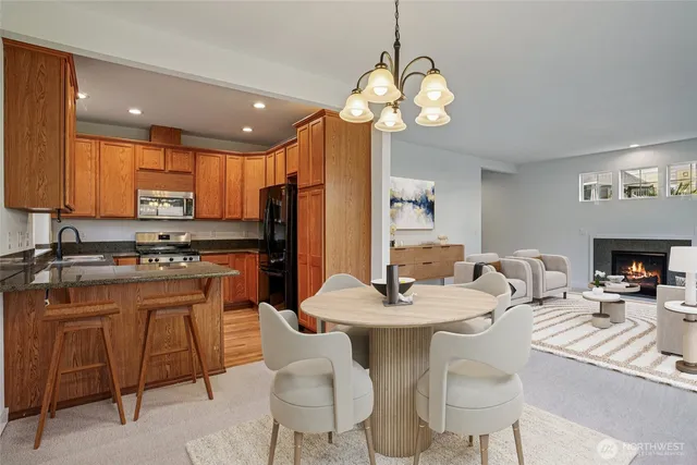 a large kitchen with a table and chairs