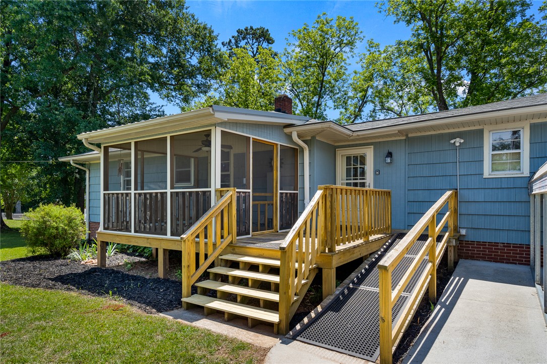 1509 869 Anderson, SC 29621 - Photo 36 of 45 A welcoming home with a screened porch and accessible ramp offers comfort and outdoor enjoyment.