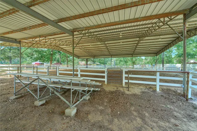 a view of a chairs and table in the backyard