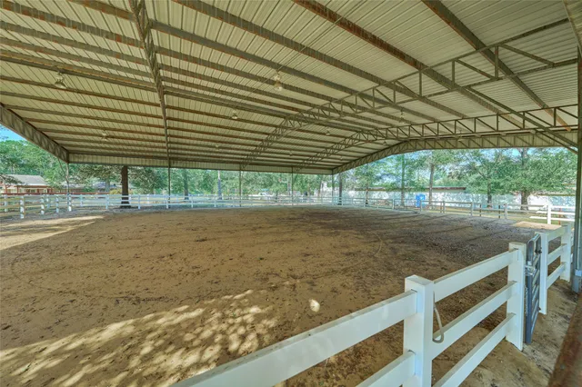 a view of a backyard with wooden fence