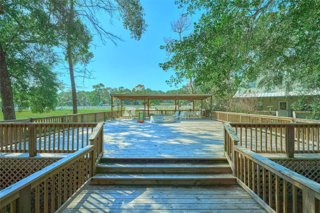 a view of balcony with deck and wooden floor