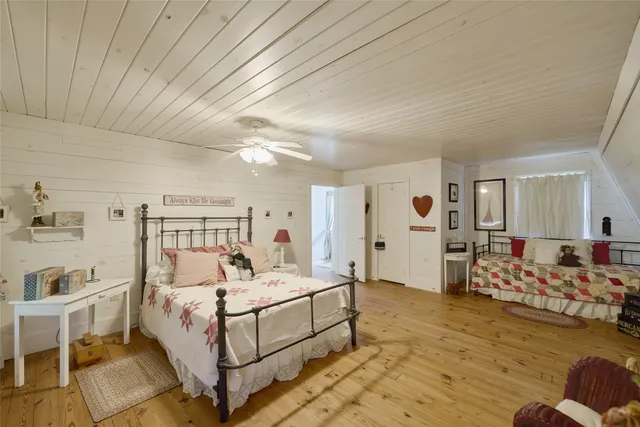 a view of a hallway with furniture