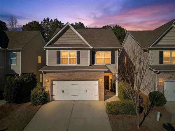 a front view of a house with a yard