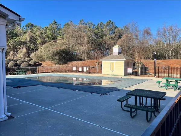 a view of swimming pool with seating space