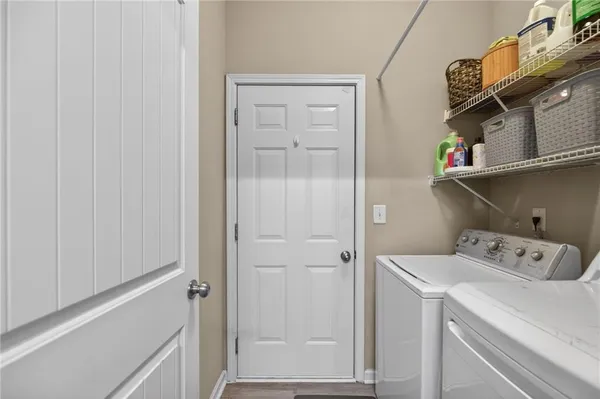 a view of storage and utility room with washer and dryer