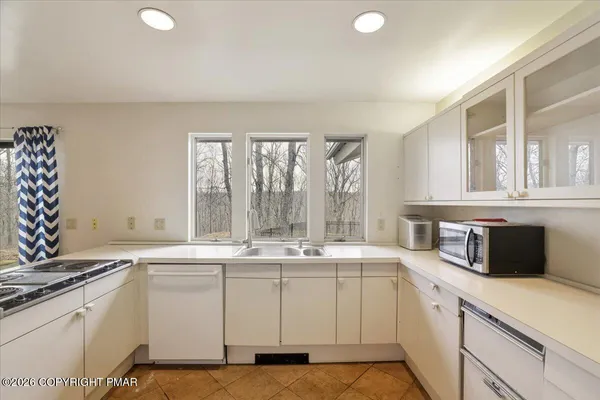 a kitchen with a sink and cabinets