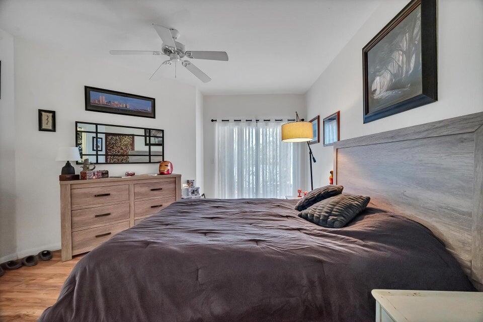 360 Southeast Rogers Court Stuart, FL 34994 - Photo 19 of 25 a bedroom with a bed and a flat screen tv