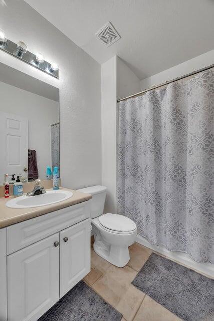 360 Southeast Rogers Court Stuart, FL 34994 - Photo 20 of 25 a bathroom with a toilet a sink and mirror