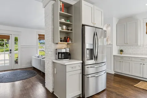 a view of a hallway with washer and dryer
