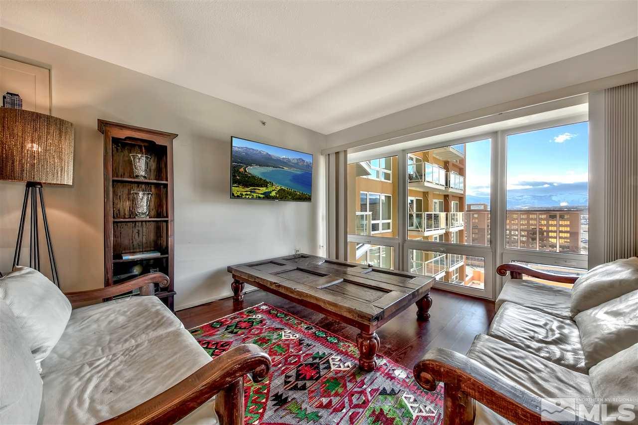 255 North Sierra Street Reno, NV 89501 - Photo 3 of 17 a living room with furniture a rug and a floor to ceiling window