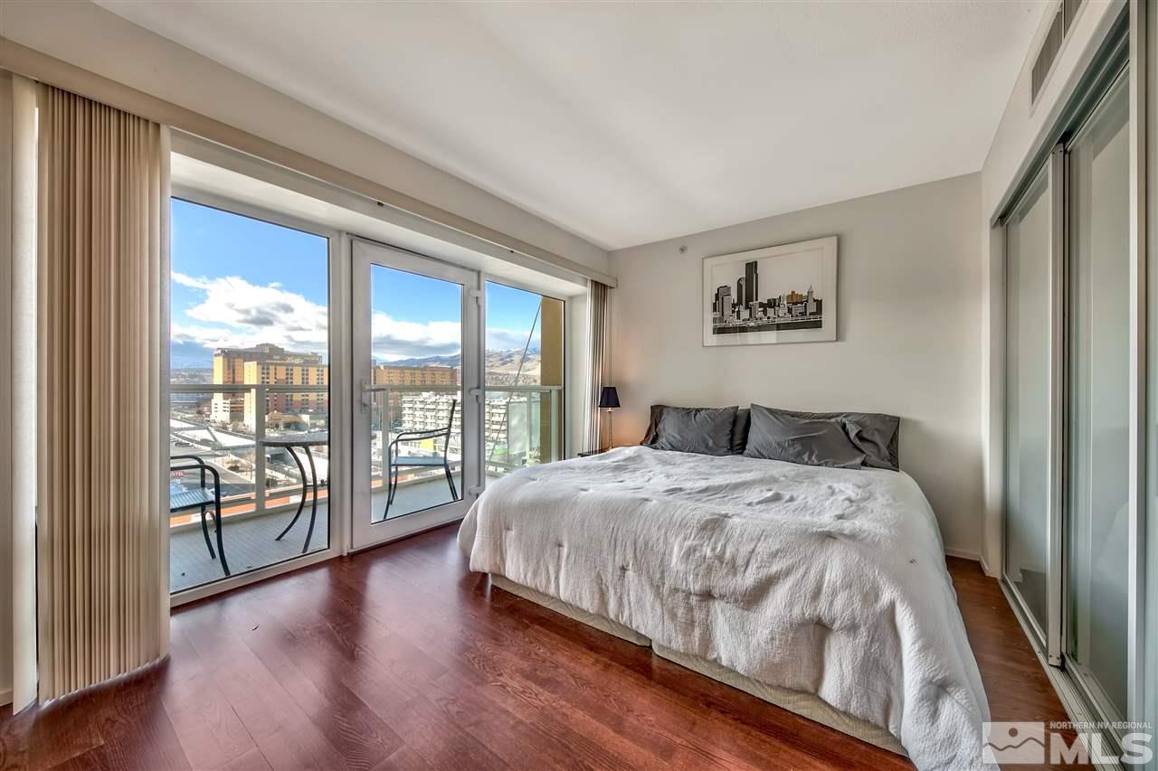 255 North Sierra Street Reno, NV 89501 - Photo 8 of 17 a bedroom with a large bed and a large window