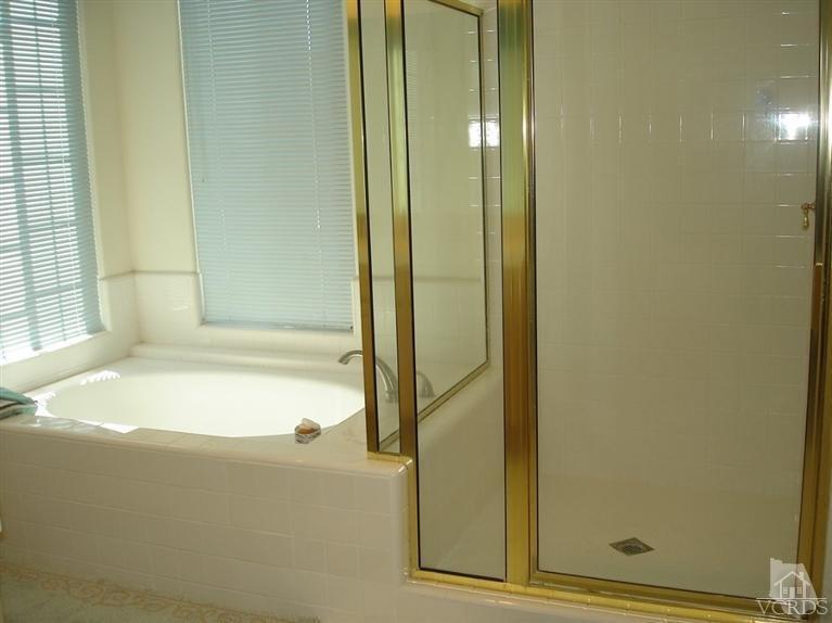 4220 Kingsview Road Moorpark, CA 93021 - Photo 40 of 54 a bathroom with a bathtub and a shower