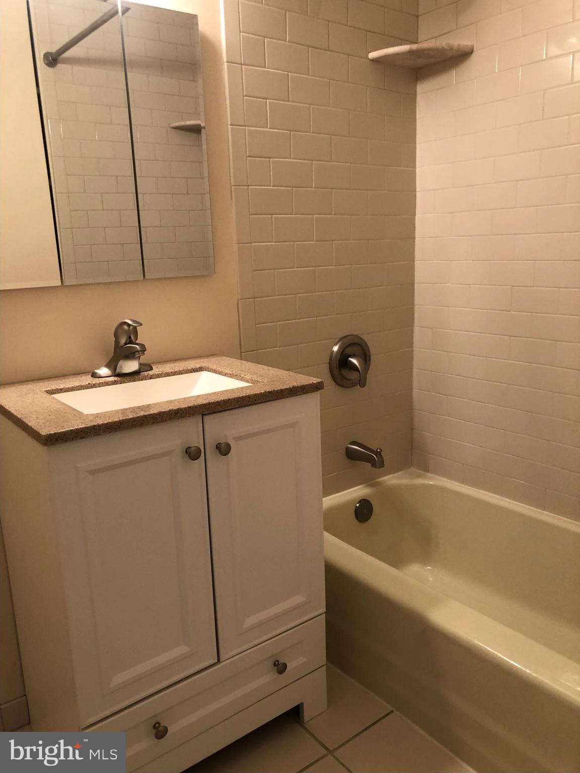 1600 Hagys Ford Road, Unit 2P Penn Valley, PA 19072 - Photo 10 of 15 a bathroom with a bathtub and a sink