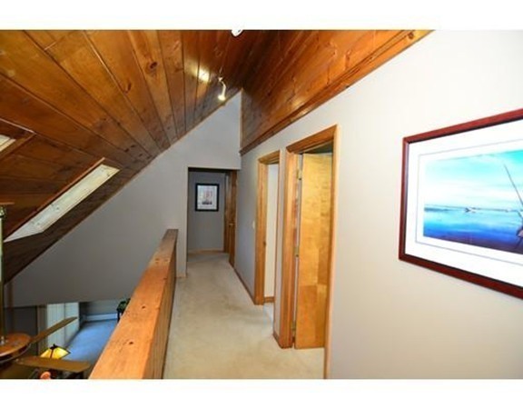 556 Burts Pit Road Northampton, MA 01062 - Photo 11 of 24 a view of a hallway with wooden floor and stairs