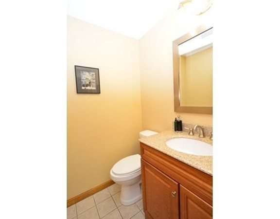 556 Burts Pit Road Northampton, MA 01062 - Photo 16 of 24 a bathroom with a toilet a sink and mirror