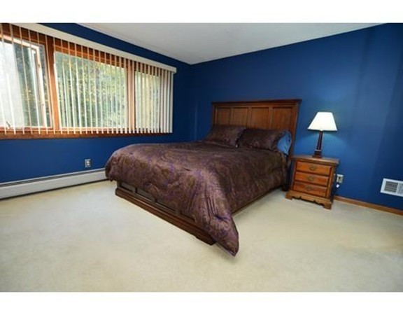556 Burts Pit Road Northampton, MA 01062 - Photo 18 of 24 a bedroom with a bed plant and a window