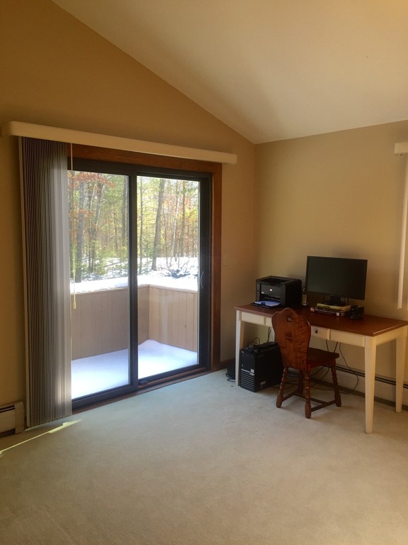 556 Burts Pit Road Northampton, MA 01062 - Photo 20 of 24 a view of a workspace with furniture and a window